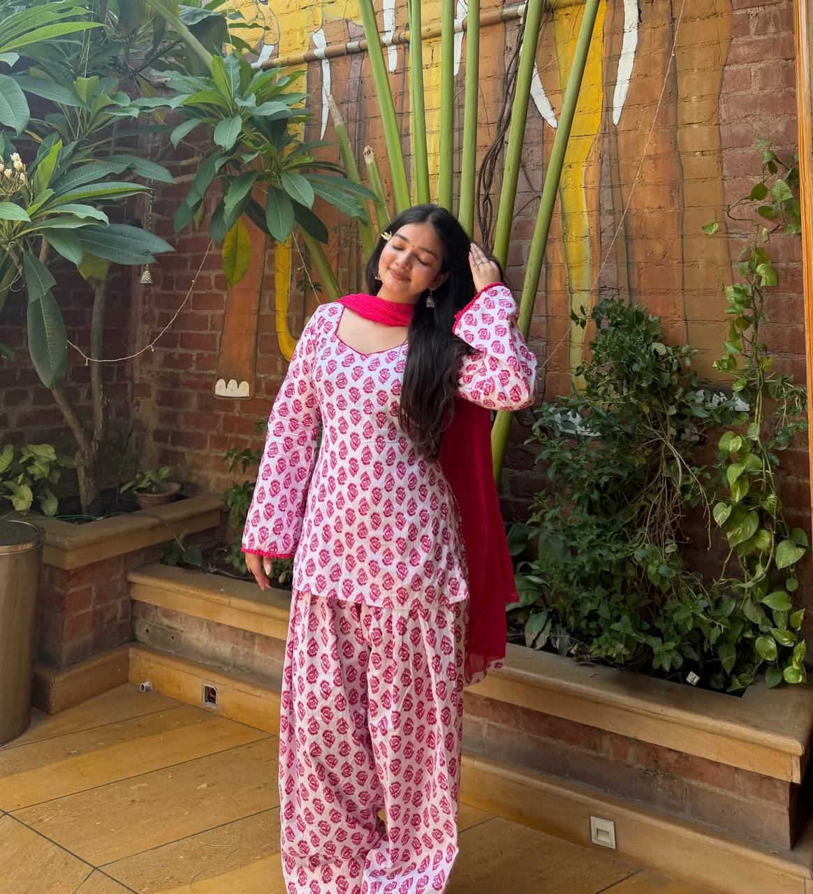 Charming Pink Floral Block Print Peplum Kurti and Wide-Leg Palazzo Suit Set Featuring an Elegant Tie-Up Back and Solid Vibrant Dupatta